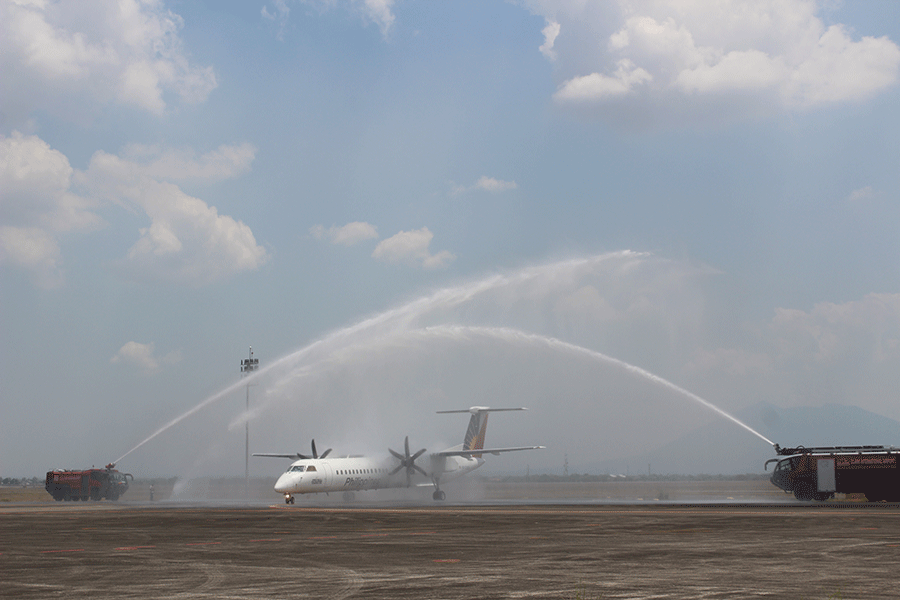 A PAL Q400 turboprop aircraft bound for Busuanga on its inaugural flight from Clark International Airport receives a water canon to mark the new domestic route that was launched today. (Photo by Ella Hernandez)