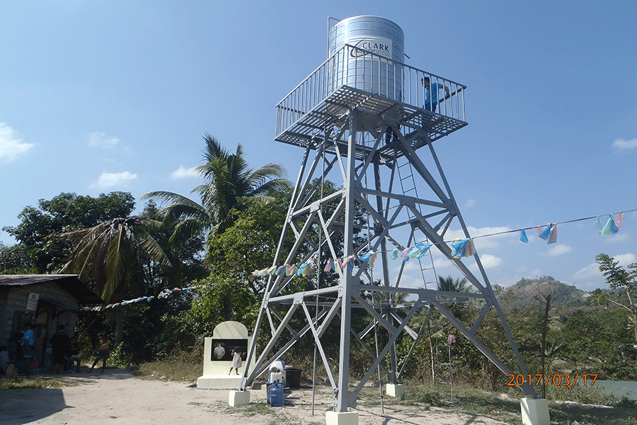 View of the water tank at Sitio Haduan. Recognizing the community’s need for potable water, Clark Development Corporation (CDC) and Manila Water Foundation (MWF) agreed to upgrade the simple hand pump rehabilitation to a complete water supply inclusive of a pumping station, pipe bridge, over head tank and communal faucet. --Photo courtesy of Cesar L. Dimabuyu